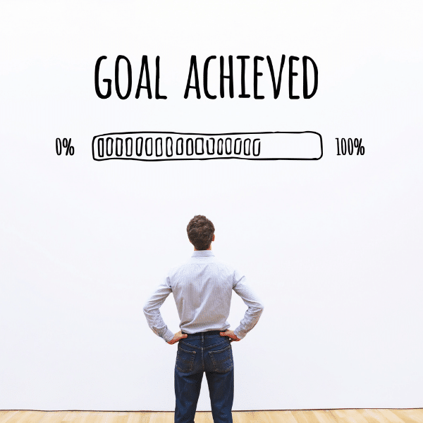 Image is of the back of a man in professional attire with the title 'Goal Achieved' above him with a bar graph showing his goal setting achievement.