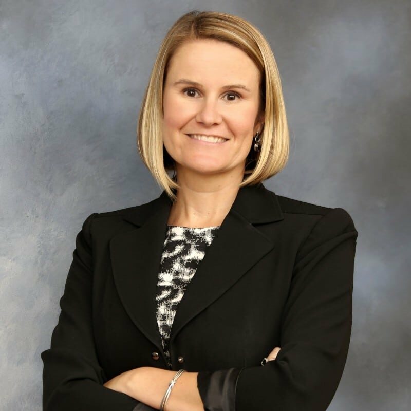 Dr. Melissa Furman, MS, DBA, appears in business attire. She writes about women in leadership, leadership development, and chamber leadership programs.
